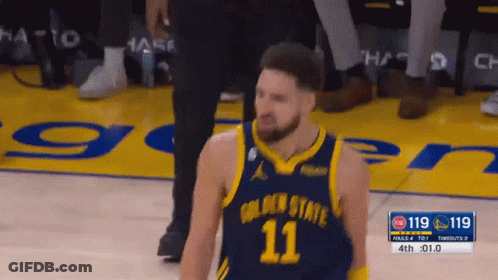A Basketball Player With The Number 11 On His Jersey Stands On The Court GIF