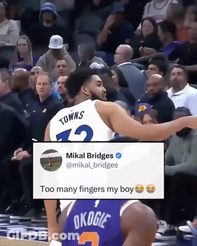 A Basketball Player With The Number 12 On His Jersey Is Talking To Another Player GIF