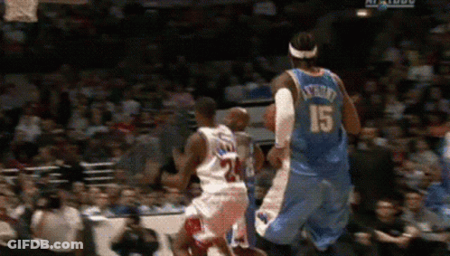 A Basketball Player With The Number 15 On His Back Is Jumping In The Air GIF