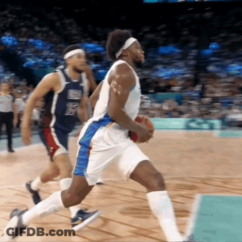 A Basketball Player With The Number 15 On His Jersey Is Dribbling The Ball GIF
