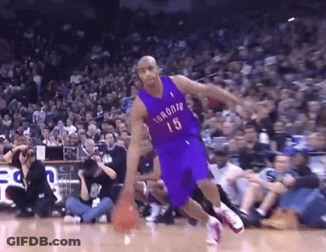 A Basketball Player With The Number 15 On His Jersey Is Dribbling The Ball GIF