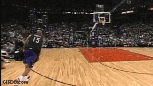 A Basketball Player With The Number 15 On His Jersey Runs Towards The Basket GIF