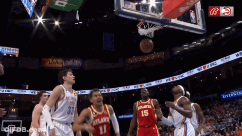 A Basketball Player With The Number 15 On His Jersey Tries To Block A Shot GIF