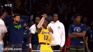 A Basketball Player With The Number 17 On His Jersey Stands In Front Of A Crowd GIF