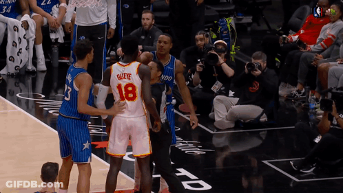 A Basketball Player With The Number 18 On His Back GIF