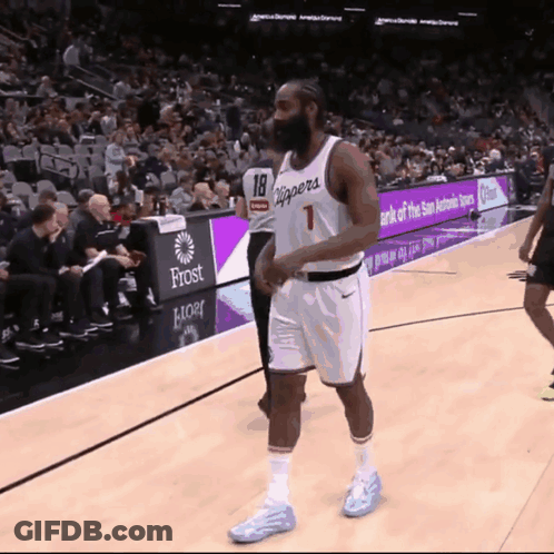A Basketball Player With The Number 18 On His Jersey Walks On The Court GIF