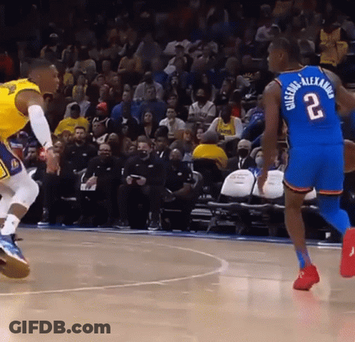 A Basketball Player With The Number 2 On His Back Dribbles The Ball GIF