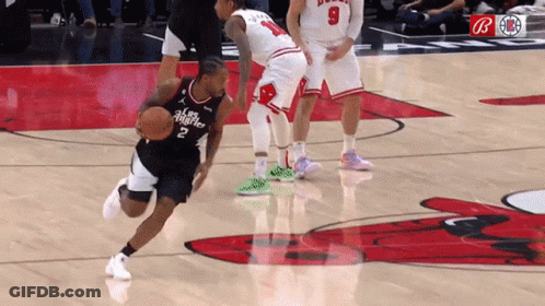 A Basketball Player With The Number 2 On His Jersey Is Dribbling A Basketball GIF