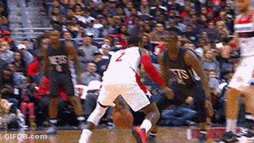 A Basketball Player With The Number 2 On His Jersey Is Dribbling The Ball GIF