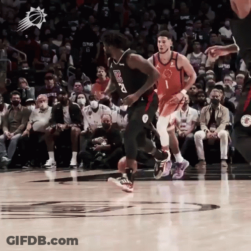 A Basketball Player With The Number 2 On His Jersey Is Dribbling The Ball GIF
