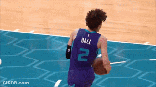 A Basketball Player With The Number 2 On His Jersey Is Running With The Ball GIF