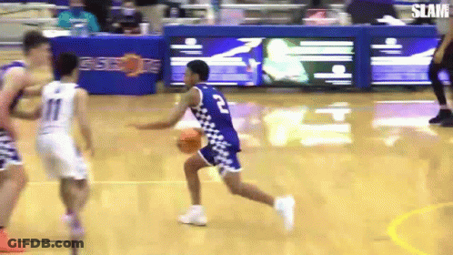 A Basketball Player With The Number 2 On His Jersey Is Running With The Ball GIF