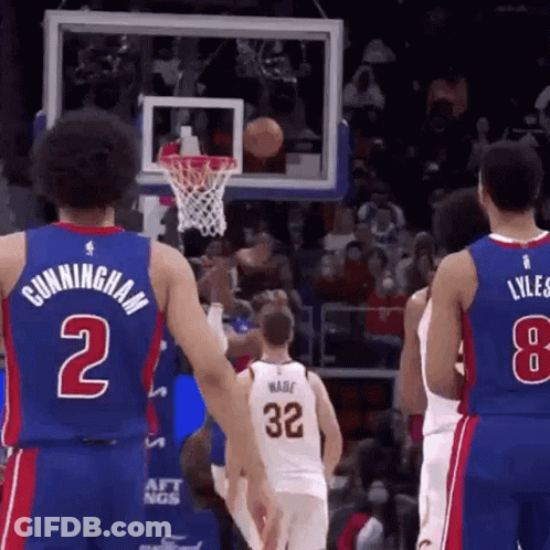 A Basketball Player With The Number 2 On His Jersey Is Standing Next To Another Player . GIF