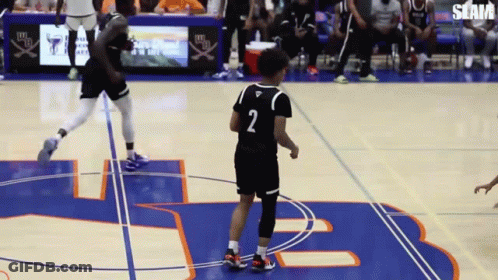 A Basketball Player With The Number 2 On His Jersey Stands On The Court GIF
