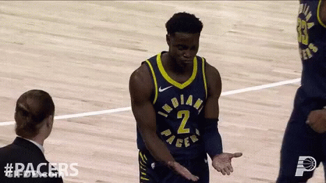 A Basketball Player With The Number 2 On His Jersey Talks To A Referee GIF