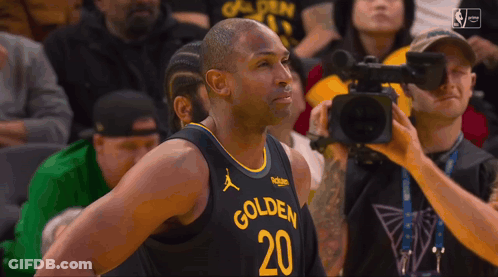 A Basketball Player With The Number 20 On His Jersey Is Being Interviewed By A Cameraman GIF