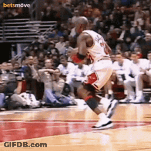 A Basketball Player With The Number 20 On His Jersey Is Jumping In The Air GIF