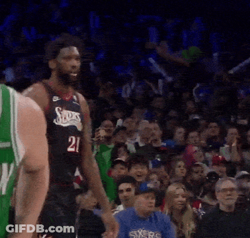 A Basketball Player With The Number 21 On His Shirt GIF