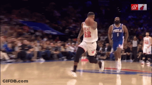 A Basketball Player With The Number 22 On His Jersey Dribbles The Ball GIF