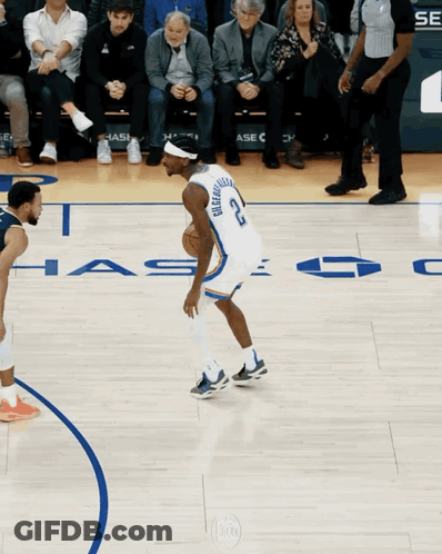 A Basketball Player With The Number 22 On His Jersey Dribbles The Ball GIF