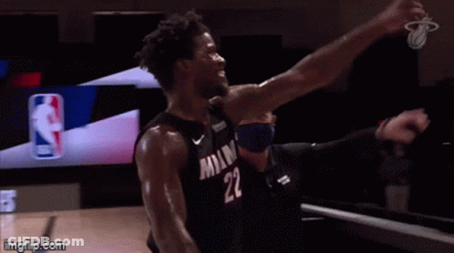 A Basketball Player With The Number 22 On His Jersey Is Celebrating . GIF