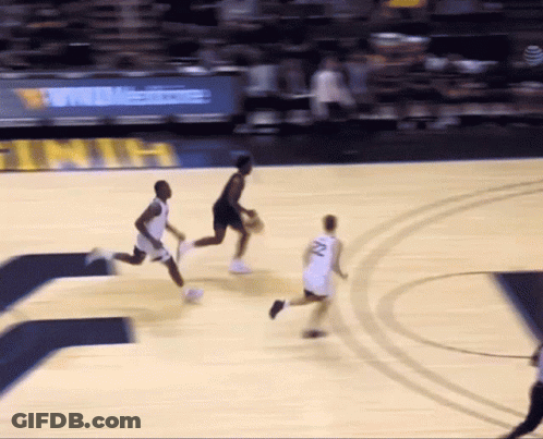 A Basketball Player With The Number 22 On His Jersey Is Dribbling The Ball GIF