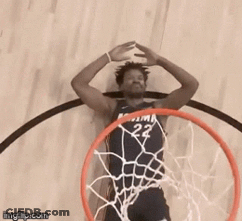 A Basketball Player With The Number 22 On His Jersey Is Going Through A Hoop GIF