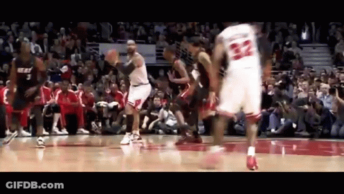 A Basketball Player With The Number 22 On His Jersey Is Jumping In The Air GIF