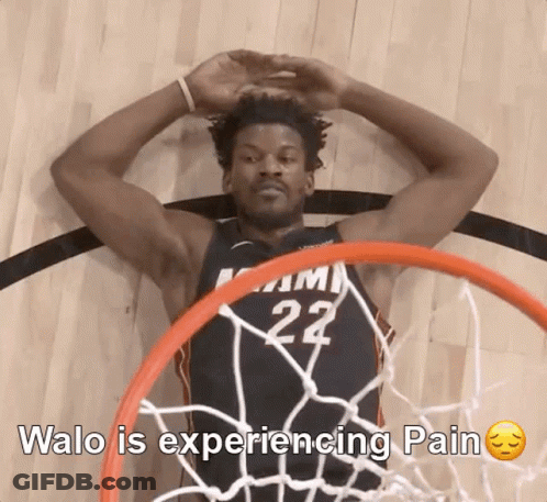 A Basketball Player With The Number 22 On His Jersey Laying On The Floor GIF