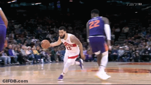 A Basketball Player With The Number 22 On His Shorts Dribbles The Ball GIF