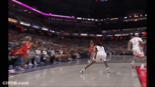 A Basketball Player With The Number 23 On Her Shorts Is Dribbling The Ball GIF