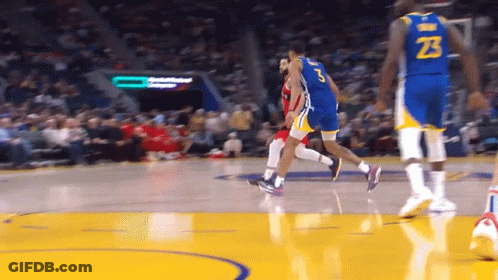 A Basketball Player With The Number 23 On His Jersey Is Dribbling The Ball GIF