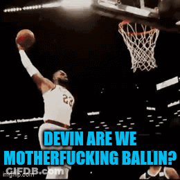 A Basketball Player With The Number 23 On His Jersey Is Dunking The Ball GIF