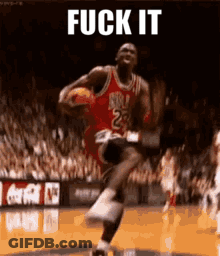 A Basketball Player With The Number 23 On His Jersey Is Jumping In The Air While Holding A Basketball . GIF