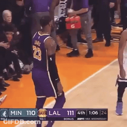 A Basketball Player With The Number 23 On His Jersey Is Standing On The Court GIF
