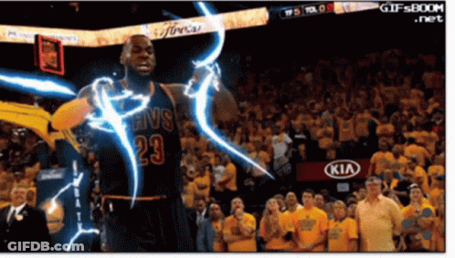A Basketball Player With The Number 23 On His Jersey Stands In Front Of A Crowd GIF