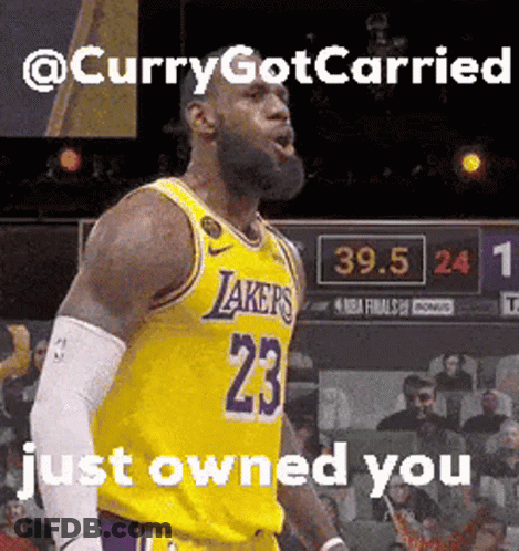 A Basketball Player With The Number 23 On His Jersey Stands On A Court GIF