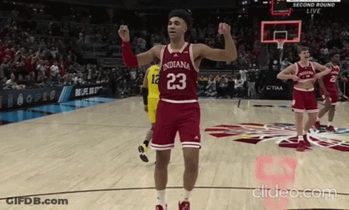 A Basketball Player With The Number 23 On His Jersey Stands On The Court GIF
