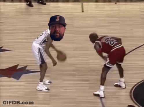 A Basketball Player With The Number 23 On His Jersey Tries To Block Another Player GIF