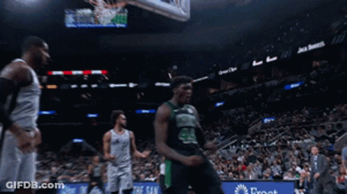 A Basketball Player With The Number 24 On His Jersey Celebrates GIF