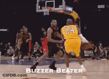 A Basketball Player With The Number 24 On His Jersey Is Being Blocked By Another Player GIF