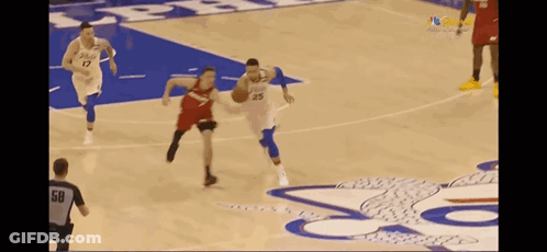 A Basketball Player With The Number 25 On His Jersey Is Dribbling A Basketball On A Court . GIF