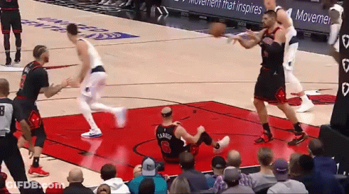 A Basketball Player With The Number 26 On His Jersey Is Laying On The Floor GIF