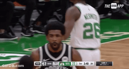 A Basketball Player With The Number 28 On His Jersey Stands On The Court GIF