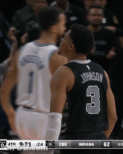A Basketball Player With The Number 3 On His Back Talks To Another Player GIF