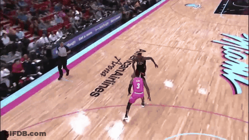 A Basketball Player With The Number 3 On His Jersey Dribbles The Ball GIF