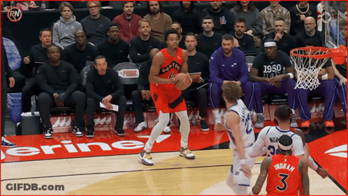A Basketball Player With The Number 3 On His Jersey Dribbles The Ball GIF