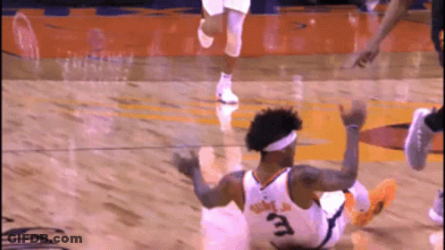 A Basketball Player With The Number 3 On His Jersey Falls To The Floor GIF