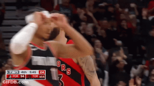 A Basketball Player With The Number 3 On His Jersey Is Celebrating GIF