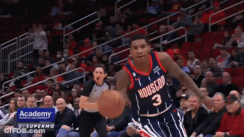 A Basketball Player With The Number 3 On His Jersey Is Dribbling The Ball GIF